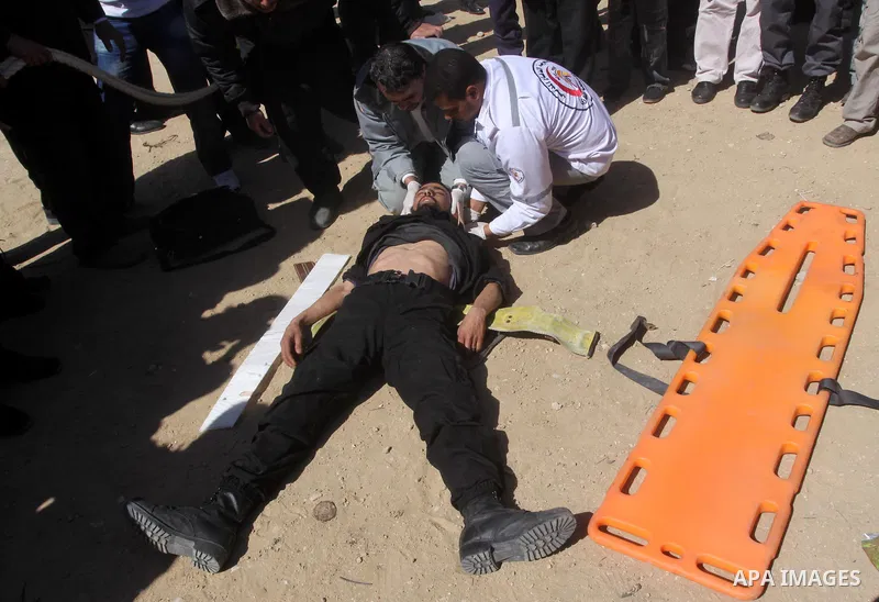 Palestinian civil defense members stage a mock rescue operation during a training exercise marking the International Civil Defense Day in Gaza city on March 2,2011 . Photo by Mohammed Asad