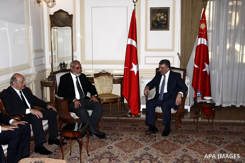 Turkish President Abdullah Gul, right, meets with Muslim Brotherhood leader Mohammed Badie in Cairo, Egypt, Thursday, March 3, 2011. Photo by Ahmed Asad