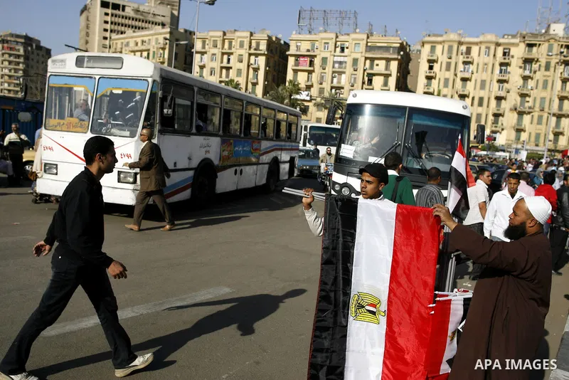 Egyptian youth sells national flags at the Tahrir square in Cairo, Egypt, Thuresday, March 3, 2011. hundreds of protesters are camping at the Tahrir square in an ongoing campaign demanding the resignation of the current...