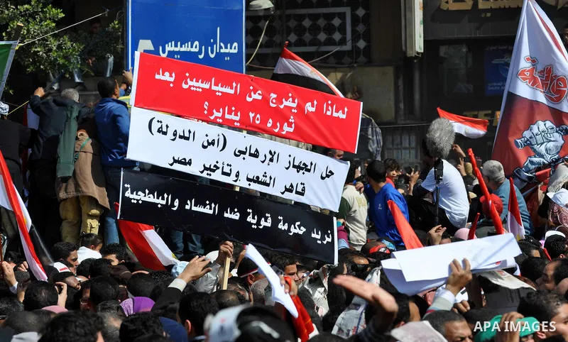 Demonstrators take part in a protest at Tahrir Square in Cairo, Egypt, Friday, March 4, 2011. Egypt's new prime minister designate has vowed before thousands of mostly young demonstrators at a central Cairo square that h...