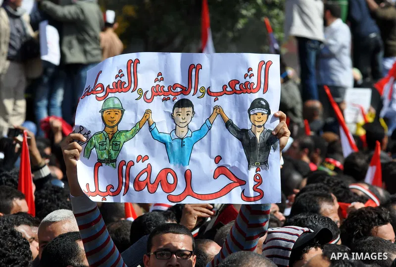 Demonstrators take part in a protest at Tahrir Square in Cairo, Egypt, Friday, March 4, 2011. Egypt's new prime minister designate has vowed before thousands of mostly young demonstrators at a central Cairo square that h...