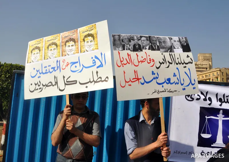 Demonstrators take part in a protest at Tahrir Square in Cairo, Egypt, Friday, March 4, 2011. Egypt's new prime minister designate has vowed before thousands of mostly young demonstrators at a central Cairo square that h...
