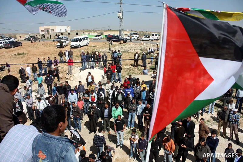 Palestinian take part during demonstration against the decision from Israeli authorities to demolish the mosque ,school and against Israel's controversial separation barrier and calling for the national reconciliation in...