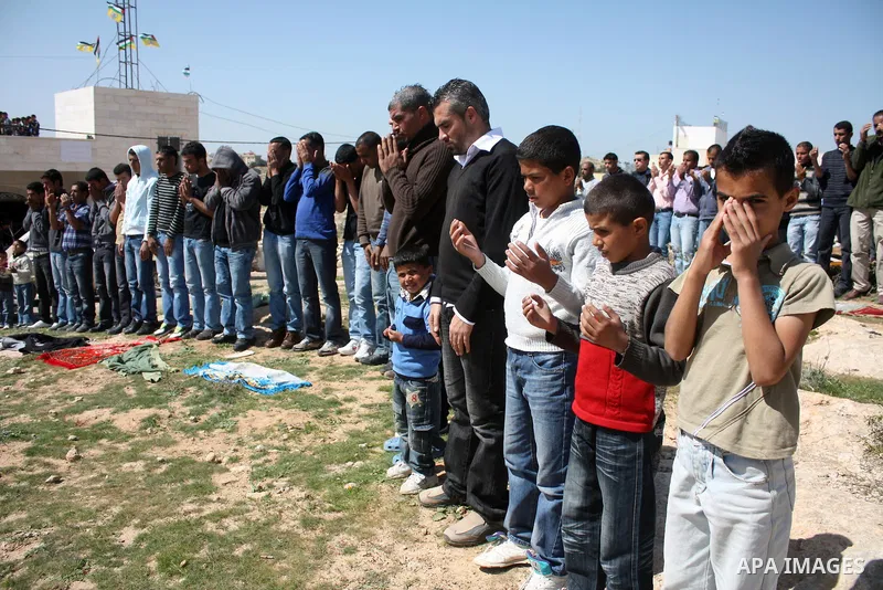 Palestinian take part during demonstration against the decision from Israeli authorities to demolish the mosque ,school and against Israel's controversial separation barrier and calling for the national reconciliation in...