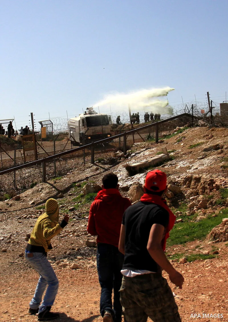 Israeli troops use an anti-riot water cannon to disperse Palestinian, Israeli, and foreign activists during clashes at a protest against the construction of Israel's separation barrier in the West Bank village of Bilin n...