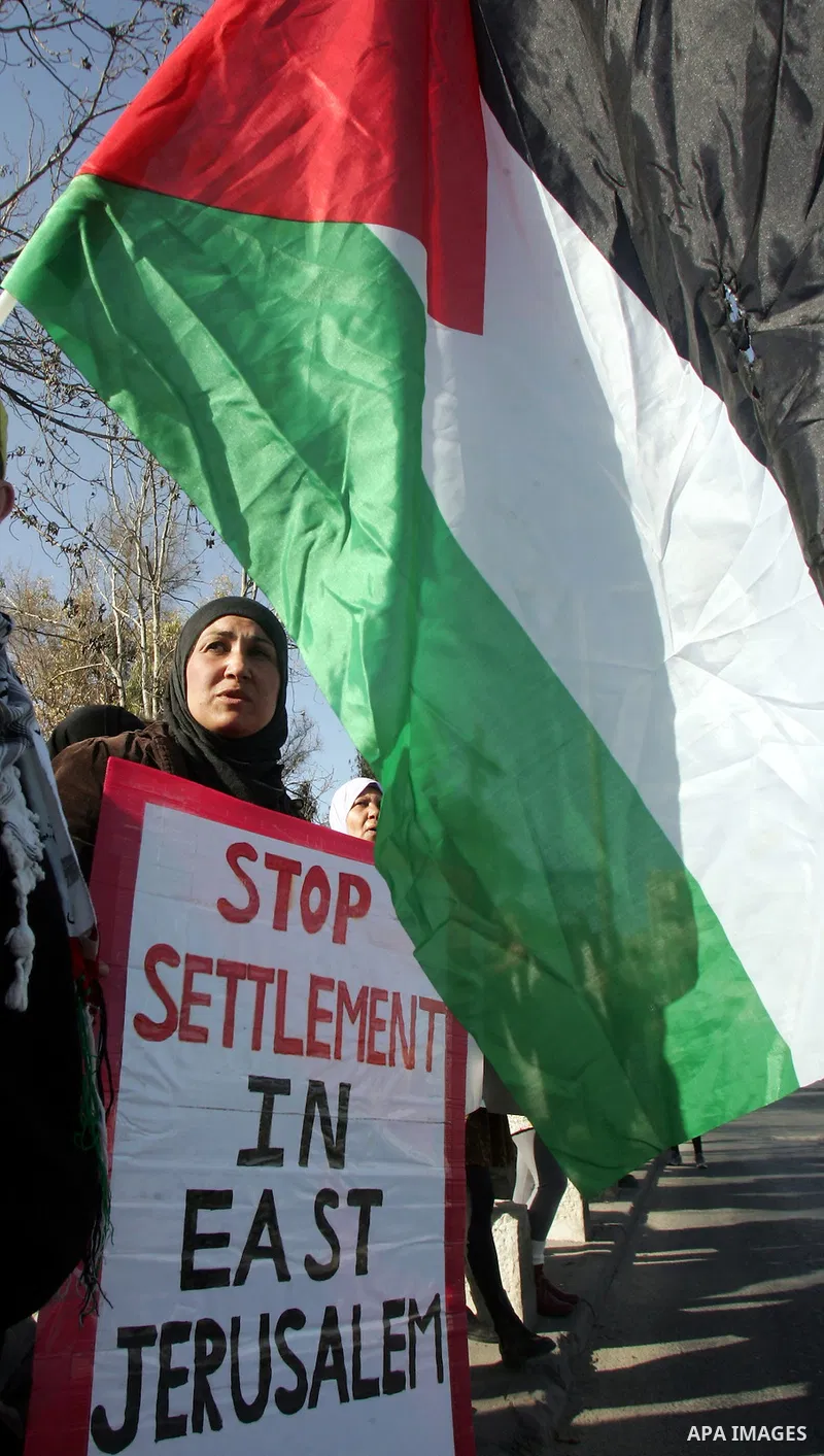 Palestinians and Israeli left-wing activists participate in a demonstration supporting Palestinians evicted from their homes in the east Jerusalem neighborhood of Sheikh Jarrah, Friday, March 4, 2011. Photo by Mahfouz Ab...