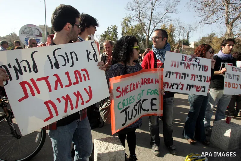 Palestinians and Israeli left-wing activists participate in a demonstration supporting Palestinians evicted from their homes in the east Jerusalem neighborhood of Sheikh Jarrah, Friday, March 4, 2011. Photo by Mahfouz Ab...