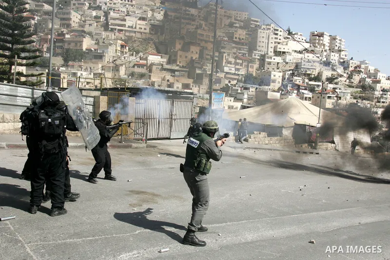 Israeli forces take positions during clashes with Palestinian youths in the east Jerusalem neighborhood of Silwan, Friday, March 4, 2011. Photo by Mahfouz Abu Turk
