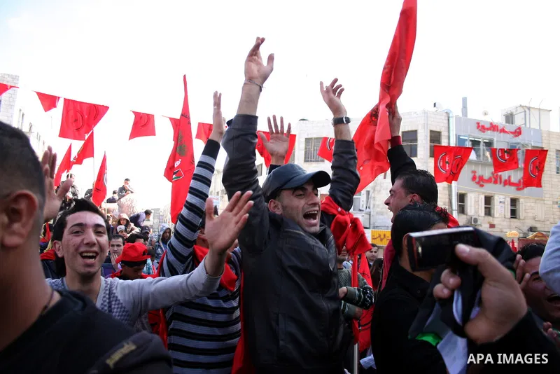 Palestinian supporters of the Palestinian Democratic Union Party (FEDA) take part in a rally celebrating 42 years since its founding in the West Bank city of Ramallah, Saturday 05 March 2011. Photo by Issam Rimawi