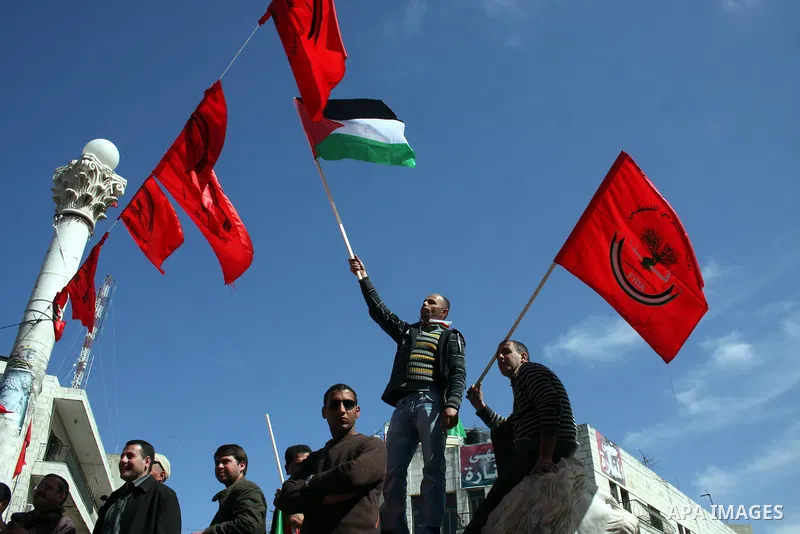 Palestinian supporters of the Palestinian Democratic Union Party (FEDA) take part in a rally celebrating 42 years since its founding in the West Bank city of Ramallah, Saturday 05 March 2011. Photo by Issam Rimawi
