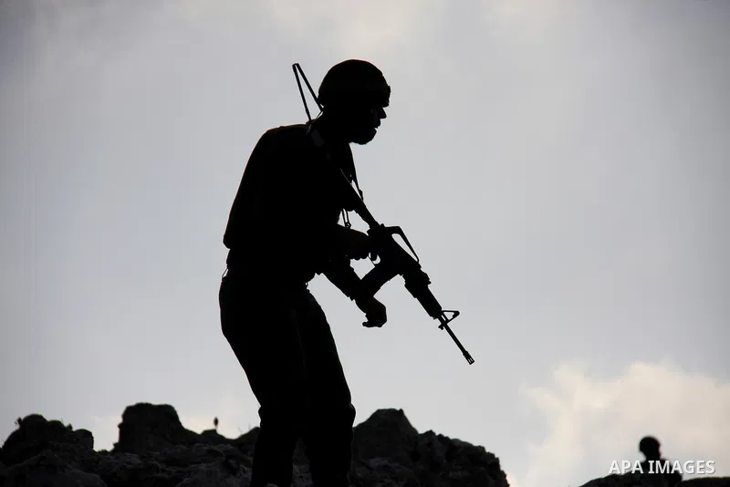 An Israeli soldier aims his weapon during a demonstration by foreign, Israeli and Palestinian activists against the expansion of Jewish settlements on March 5, 2011 in the village of Iraq Burin, south of the northern Wes...