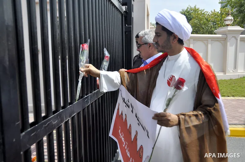 Bahraini anti-government protesters take part in a demonstration, Sunday, March 6, 2011, as thousands circle the Gudaibiya Palace compound in Manama, Bahrain, where the office of Prime Minister Khalifa bin Salman Al Khal...
