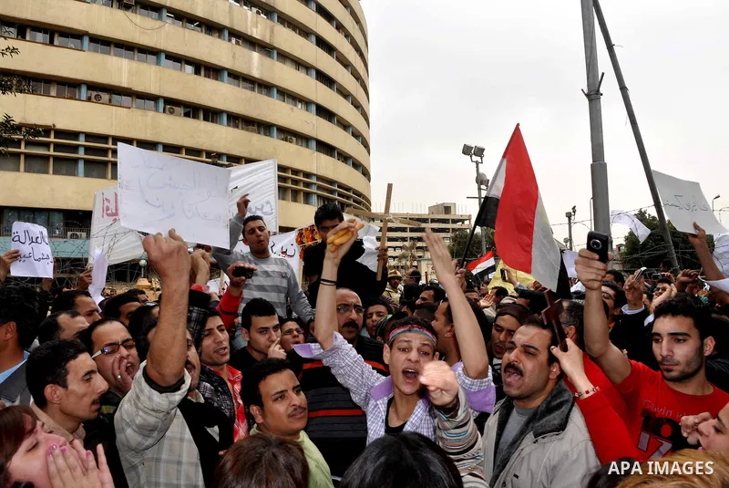 Egyptian christian protesters take part in a demonstration after burning a church in Hilwan, in front of the state television building headquarters in Cairo, Egypt, Sunday, March 6, 2011. Three weeks after President Hosn...