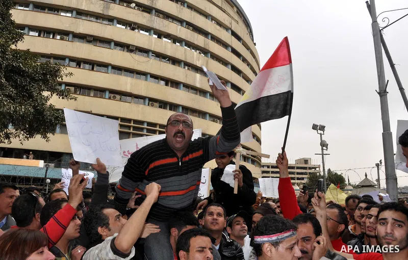 Egyptian christian protesters take part in a demonstration after burning a church in Hilwan, in front of the state television building headquarters in Cairo, Egypt, Sunday, March 6, 2011. Three weeks after President Hosn...