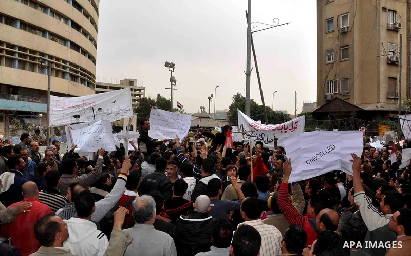 Egyptian christian protesters take part in a demonstration after burning a church in Hilwan, in front of the state television building headquarters in Cairo, Egypt, Sunday, March 6, 2011. Three weeks after President Hosn...