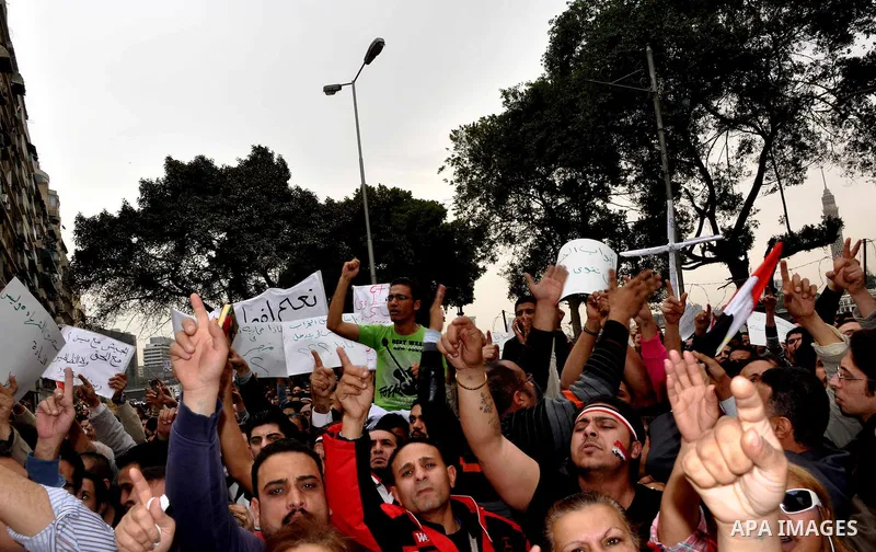 Egyptian christian protesters take part in a demonstration after burning a church in Hilwan, in front of the state television building headquarters in Cairo, Egypt, Sunday, March 6, 2011. Three weeks after President Hosn...