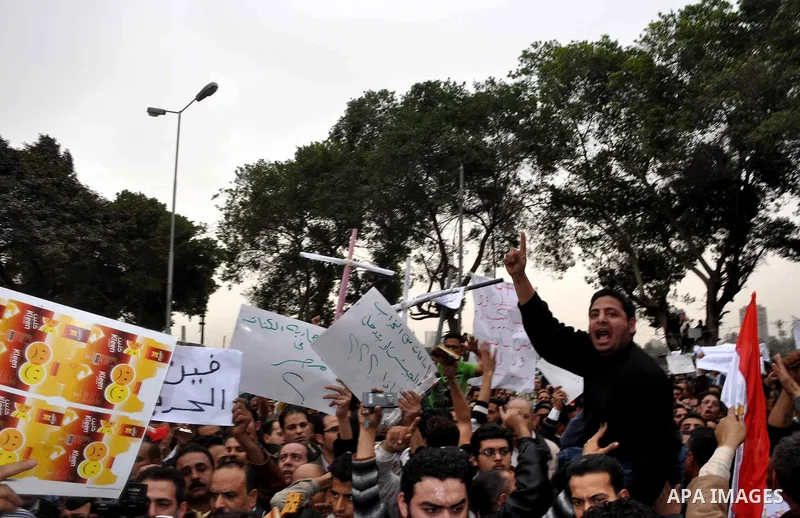 Egyptian christian protesters take part in a demonstration after burning a church in Hilwan, in front of the state television building headquarters in Cairo, Egypt, Sunday, March 6, 2011. Three weeks after President Hosn...