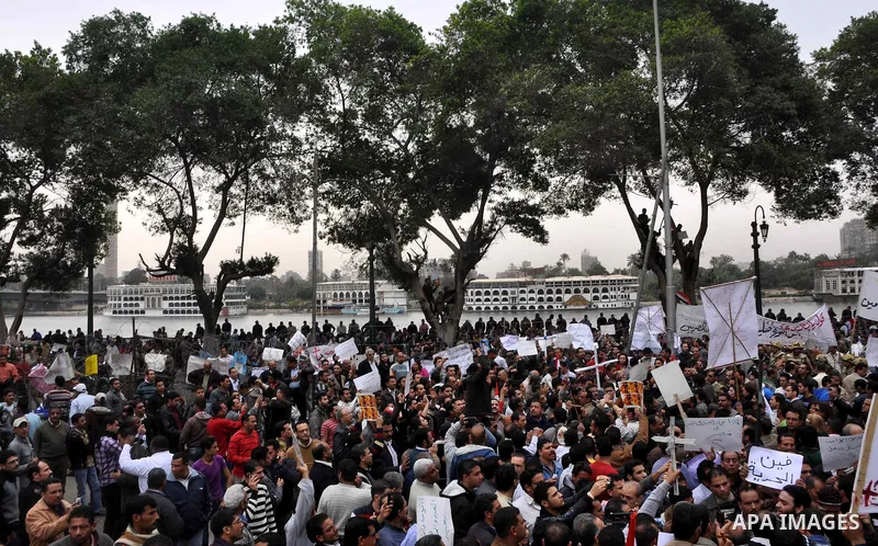 Egyptian christian protesters take part in a demonstration after burning a church in Hilwan, in front of the state television building headquarters in Cairo, Egypt, Sunday, March 6, 2011. Three weeks after President Hosn...