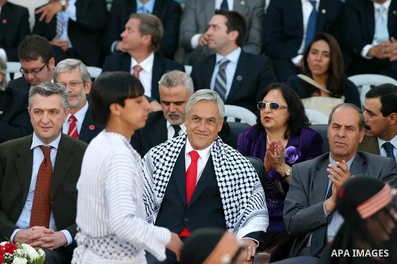 Chilean President Sebastian Pinera and his wife Cecilia Morel are greeted by Palestinian during their arrival at the Church of the Nativity, the site revered as the birthplace of Jesus, in the West Bank town of Bethlehem...