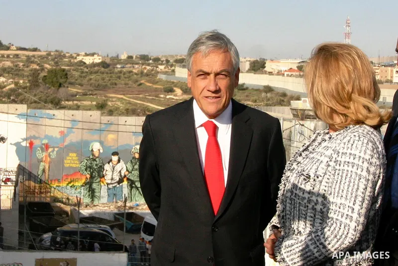 Chilean President Sebastian Pinera and his wife Cecilia Morel are greeted by Palestinian during their arrival at the Church of the Nativity, the site revered as the birthplace of Jesus, in the West Bank town of Bethlehem...