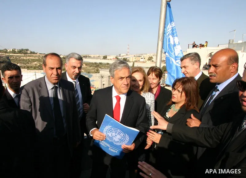 Chilean President Sebastian Pinera and his wife Cecilia Morel are greeted by Palestinian during their arrival at the Church of the Nativity, the site revered as the birthplace of Jesus, in the West Bank town of Bethlehem...