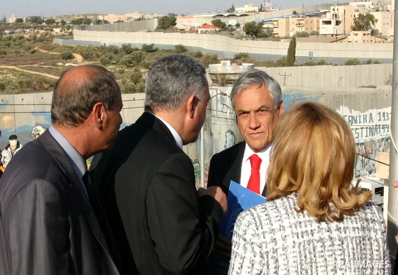 Chilean President Sebastian Pinera and his wife Cecilia Morel are greeted by Palestinian during their arrival at the Church of the Nativity, the site revered as the birthplace of Jesus, in the West Bank town of Bethlehem...