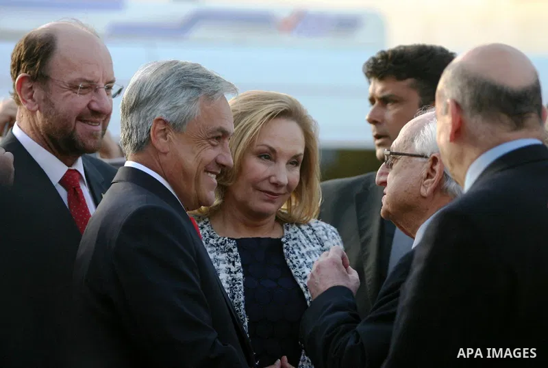 Chilean President Sebastian Pinera and his wife Cecilia Morel are greeted by Palestinian during their arrival at the Church of the Nativity, the site revered as the birthplace of Jesus, in the West Bank town of Bethlehem...