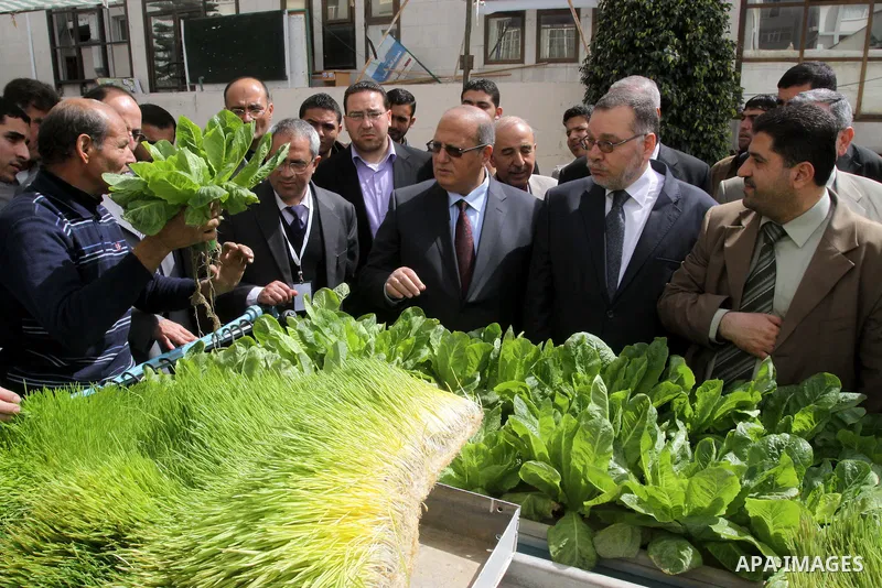 Palestinians participate in the second exhibition for the national agricultural and industrial products at the Islamic University, in Gaza city on March 6,2011. Photo by Mohammed Asad
