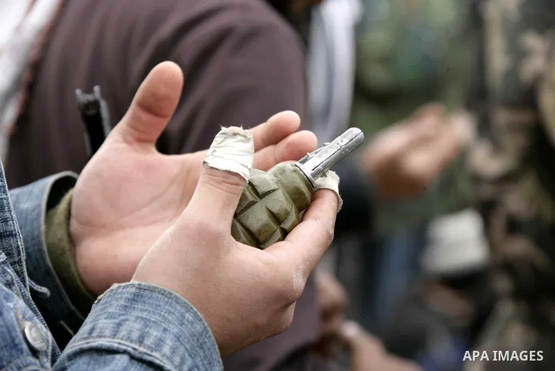 Rebel fighters return fire during shelling by soldiers loyal to Libyan leader Muammar Gaddafi in a battle near Ras Lanuf, March 4, 2011. Heavily armed rebels clashed with forces loyal to Gaddafi on Friday on the outskirt...