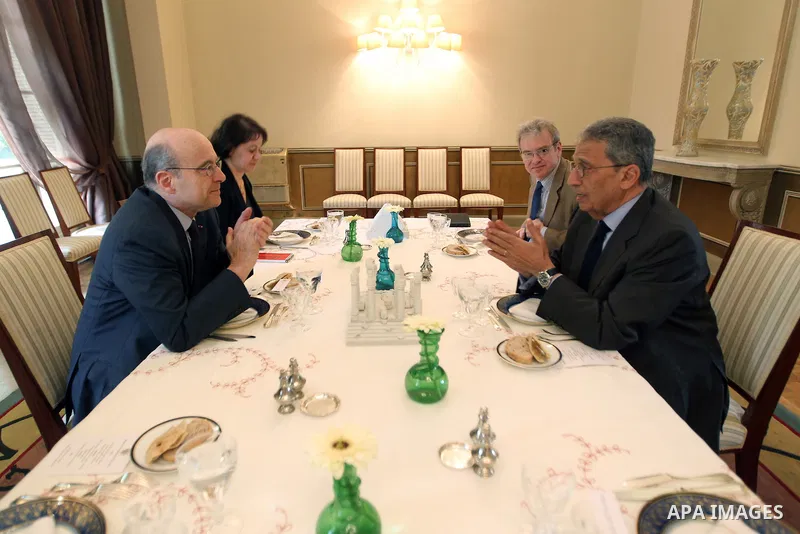 French newly appointed Foreign Minister Alain Juppe (L) meets with the Arab League general secretary Amr Mussa (R) in Cairo on March 6, 2011 as part of a visit during which he affirmed his country's commitment to Egypt....