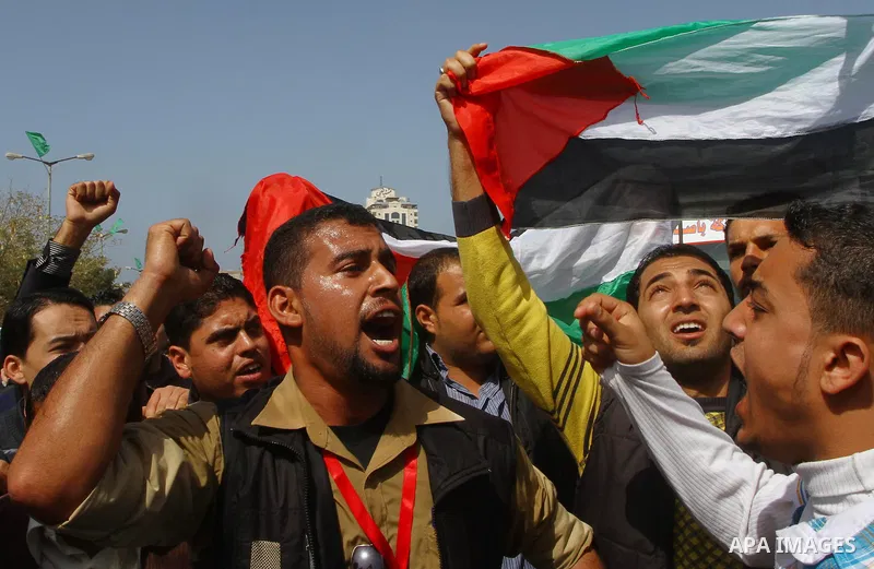 Palestinians shout slogans during a protest in Gaza City calling for unity between the Hamas Islamist group and its bitter West Bank rival Fatah party, on March 7, 2011, a day after Hamas police detained several proteste...