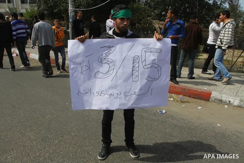 Palestinians shout slogans during a protest in Gaza City calling for unity between the Hamas Islamist group and its bitter West Bank rival Fatah party, on March 7, 2011, a day after Hamas police detained several proteste...