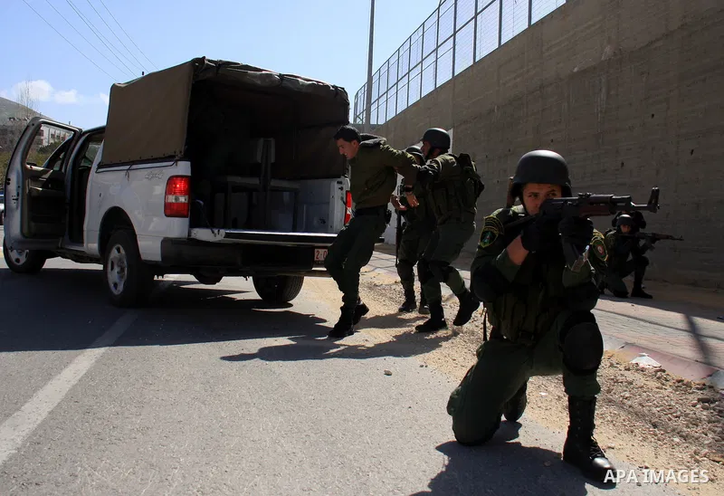 Palestinian security officers take part in a training session in the West Bank city of Nablus, Monday, March 7, 2011 . Photo by Wagdi Eshtayah
