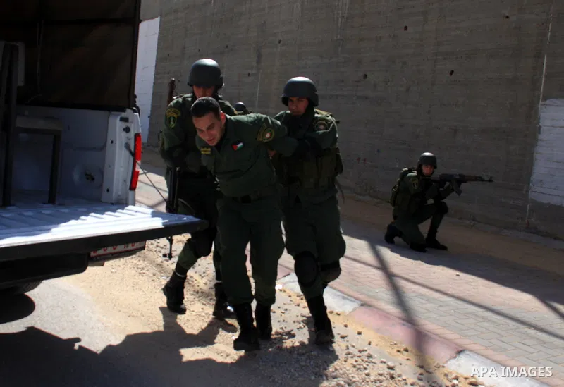 Palestinian security officers take part in a training session in the West Bank city of Nablus, Monday, March 7, 2011 . Photo by Wagdi Eshtayah