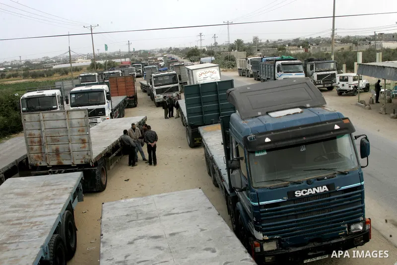 Palestinians stop with their lorries near the crossing of the Israeli crossing Kerem Shalom during a protest against the Israeli decision to close the Karni crossing, in the southern Gaza Strip on March 07, 2011. The own...