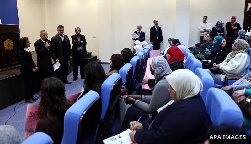 Palestinian Prime Minister, Salam Fayyad receives a note from the Palestinian workers general union about the rights of women workers in the West Bank city of Ramallah on March7, 2011. Photo by Mustafa Abu Dayeh