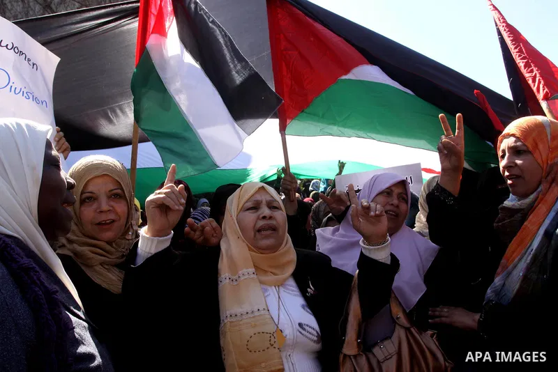 Palestinian women attend a rally calling for an end to Palestinian divisions, to mark International Women's Day in Gaza City March 8, 2011. Female protesters rallied to voice their frustrations over the unending split be...