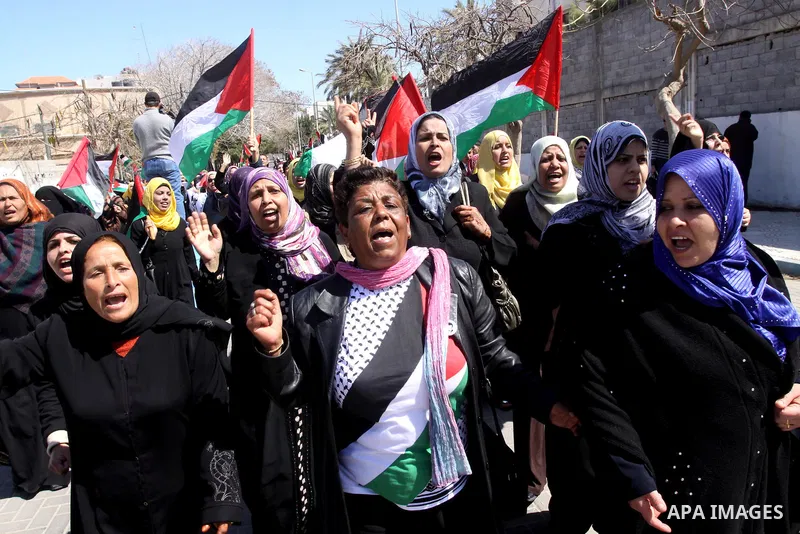 Palestinian women attend a rally calling for an end to Palestinian divisions, to mark International Women's Day in Gaza City March 8, 2011. Female protesters rallied to voice their frustrations over the unending split be...