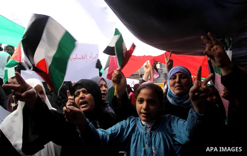 Palestinian women attend a rally calling for an end to Palestinian divisions, to mark International Women's Day in Gaza City March 8, 2011. Female protesters rallied to voice their frustrations over the unending split be...