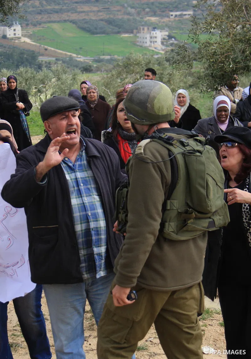Palestinian women shout slogans during women's demonstration in the West Bank village of Burin, near Nablus, Tuesday ,March 8, 2011. The protest was organized by Palestinian women to mark the International Women's Day an...