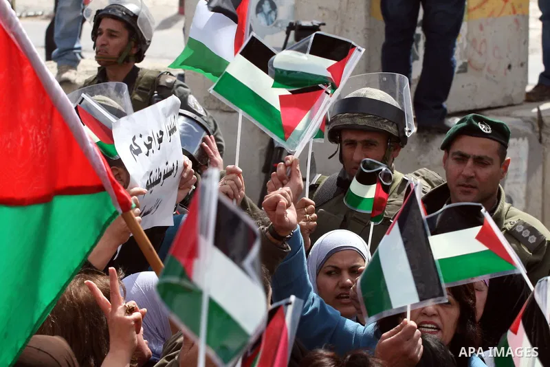 Palestinian women protest against the Israeli occupation of Palestinian territories on the occasion of women's day on March 8, 2011 at the Israeli-controlled Qalandia checkpoint, between Jerusalem and Ramallah. photo by:...