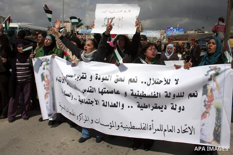 Palestinian women protest against the Israeli occupation of Palestinian territories on the occasion of women's day on March 8, 2011 at the Israeli-controlled Qalandia checkpoint, between Jerusalem and Ramallah. photo by:...