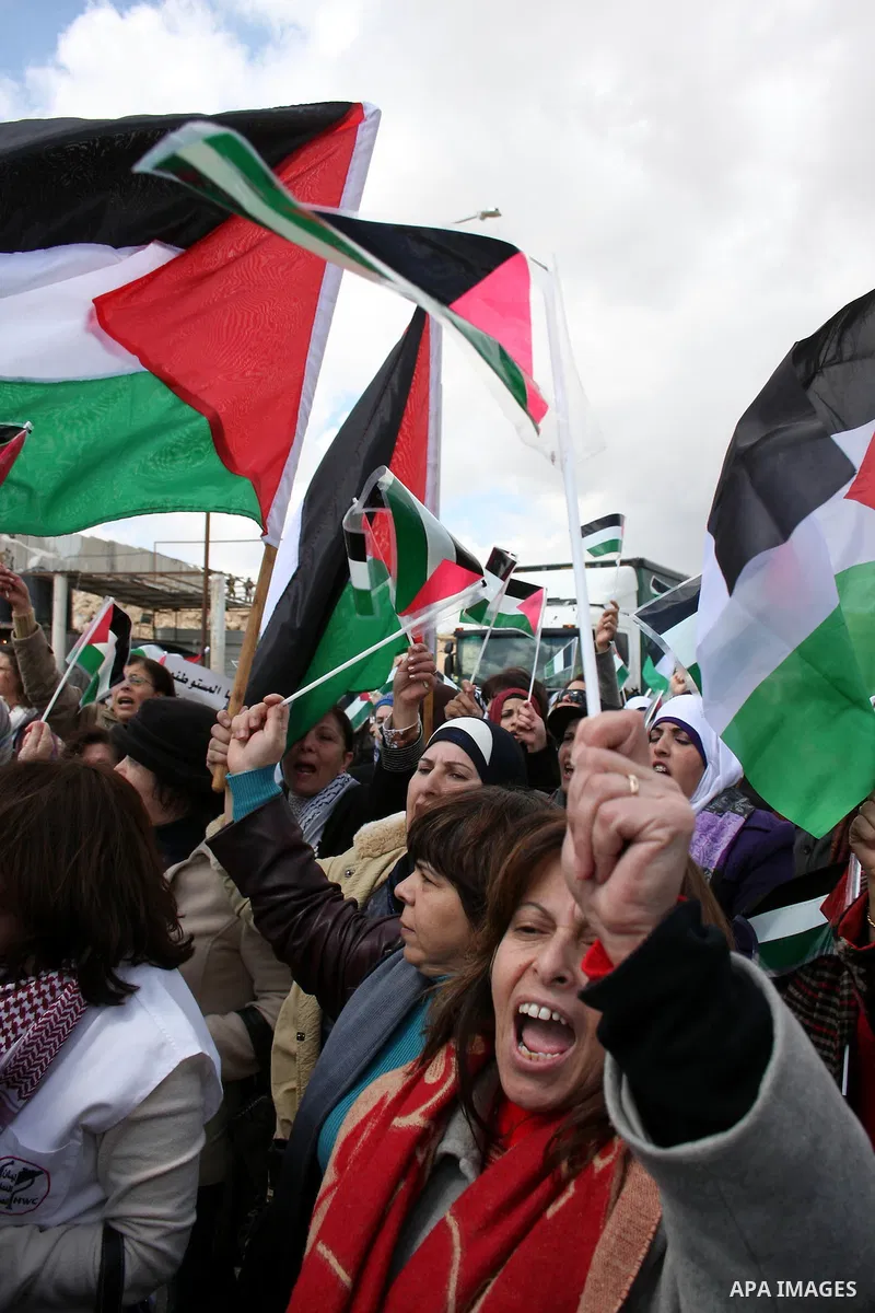 Palestinian women protest against the Israeli occupation of Palestinian territories on the occasion of women's day on March 8, 2011 at the Israeli-controlled Qalandia checkpoint, between Jerusalem and Ramallah. photo by:...