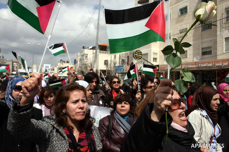 Palestinian women protest against the Israeli occupation of Palestinian territories on the occasion of women's day on March 8, 2011 at the Israeli-controlled Qalandia checkpoint, between Jerusalem and Ramallah. photo by:...