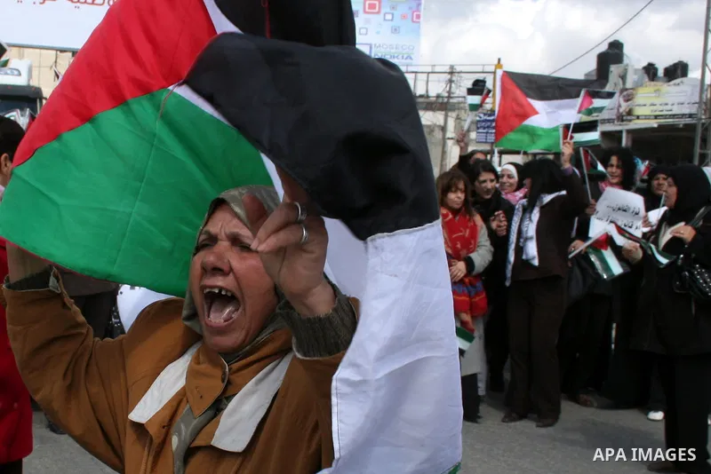 Palestinian women protest against the Israeli occupation of Palestinian territories on the occasion of women's day on March 8, 2011 at the Israeli-controlled Qalandia checkpoint, between Jerusalem and Ramallah. photo by:...