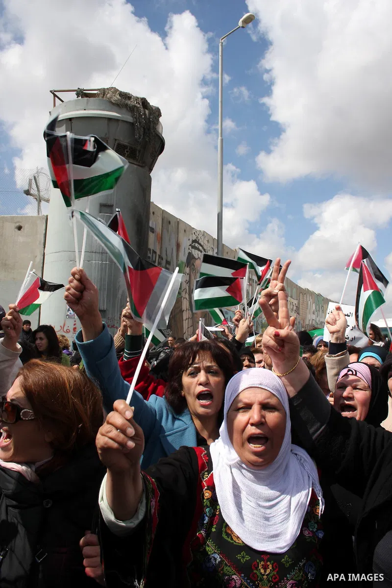 Palestinian women protest against the Israeli occupation of Palestinian territories on the occasion of women's day on March 8, 2011 at the Israeli-controlled Qalandia checkpoint, between Jerusalem and Ramallah. photo by:...