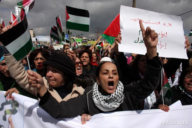 Palestinian women protest against the Israeli occupation of Palestinian territories on the occasion of women's day on March 8, 2011 at the Israeli-controlled Qalandia checkpoint, between Jerusalem and Ramallah. photo by:...