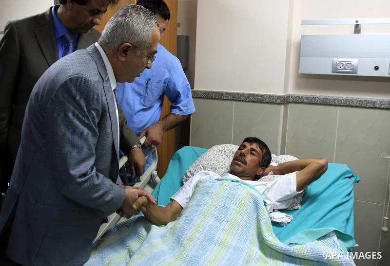 Palestinian Prime Minister Salam Fayyad visits the wounded Palestinians who injured during attack by Israeli settlers, at Rafidia hospital in the West Bank city of Nablus ,Tuesday, March 8, 2011. Jewish settlers opened f...