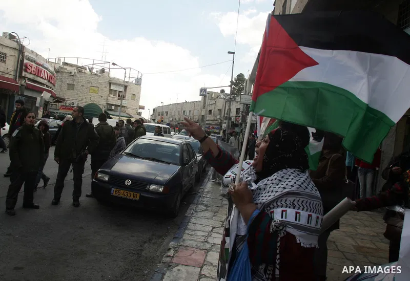 Palestinian women demonstrate against Israel during a women's day protest at Damascus Gate in Jerusalem's Old City on March 8,2011. Photo by Mahfouz Abu Turk