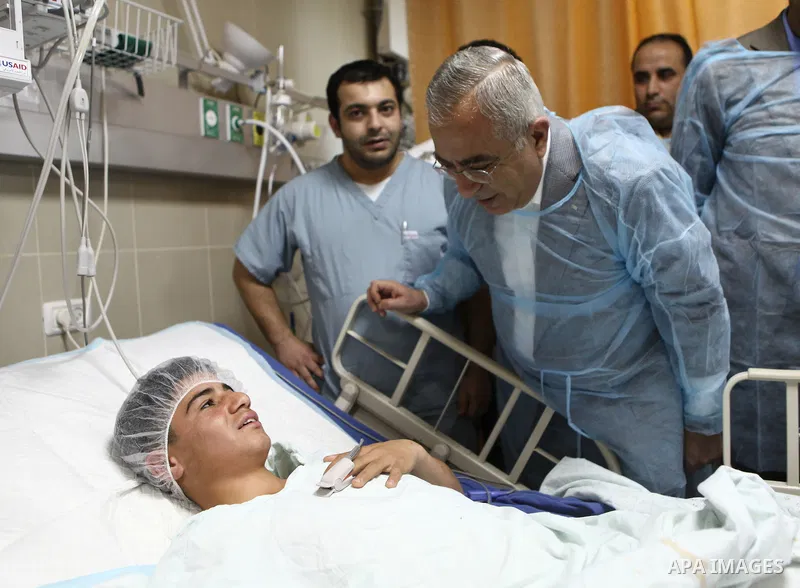 Palestinian Prime Minister Salam Fayyad pays a visit to Rafidya hospital in the West Bank city of Nablus on 08 March 2011, to meet some of the ten Palestinians wounded during the previous day clashes with Jewish settlers...